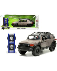 Toyota FJ Cruiser with Roof Rack Brown and Black "Toyo Tires" with Extra Wheels "Just Trucks" Series 1/24 Diecast Model Car by Jada