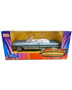 1963 Chevrolet Impala Convertible Lowrider Light Blue Metallic with White Interior "Low Rider Collection" 1/24 Diecast Model Car by Welly