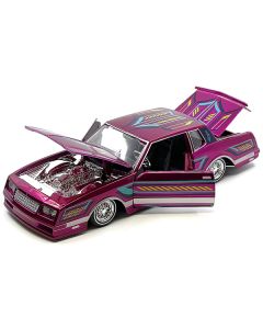 1986 Chevrolet Monte Carlo SS Lowrider Pink Metallic with Graphics "Lowriders" Series 1/24 Diecast Model Car by Maisto