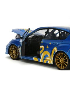 2012 Subaru Impreza WRX STI Blue Metallic with Graphics and Sonic The Hedgehog Diecast Figure "Sonic The Hedgehog" "Hollywood Rides" Series 1/24 Diecast Model Car by Jada